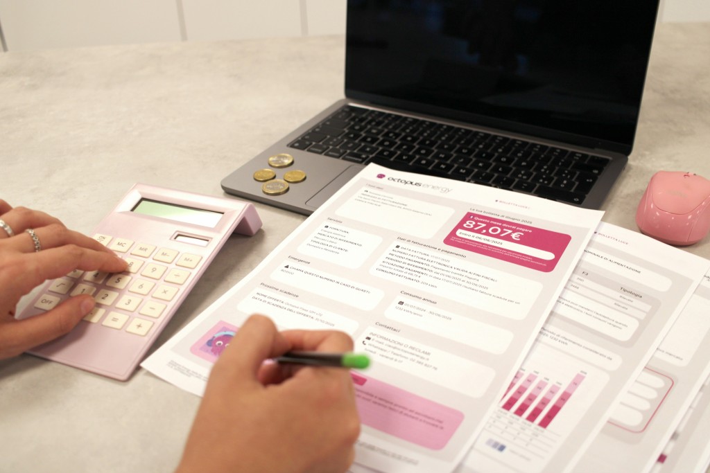someone is calculating their finances with documents by Giorgio Tomassetti on Unsplash